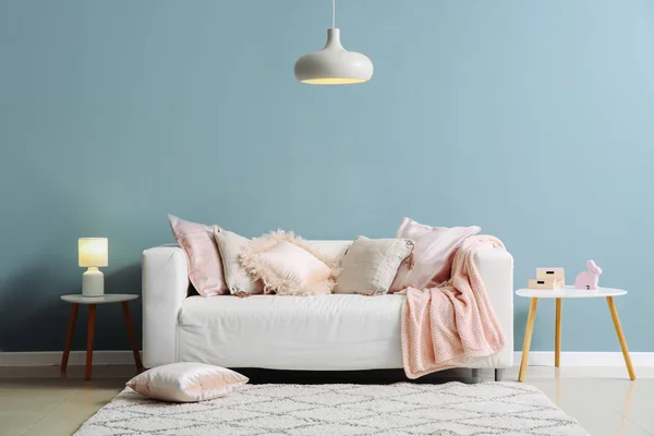 Interior of room with comfortable sofa near color wall — Stock Photo, Image