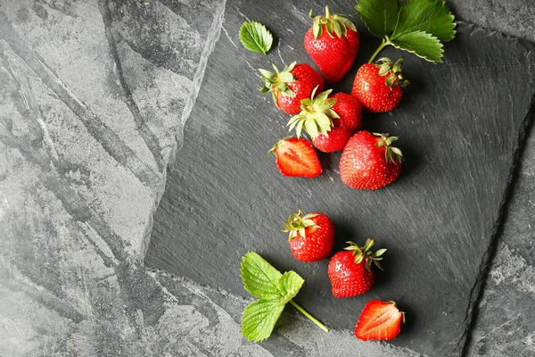 Ripe red strawberry on grey background — Stock Photo, Image