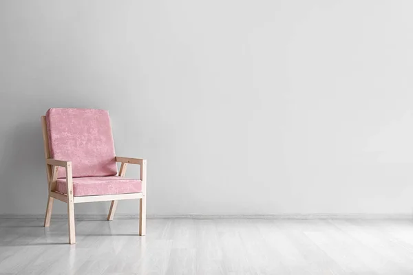 Comfortable armchair near light wall — Stock Photo, Image