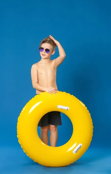 Cute little boy with inflatable ring on color background — Stock Photo, Image