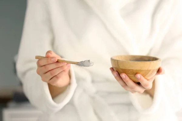 Young woman with bowl of cosmetic clay, closeup — Stock Photo, Image