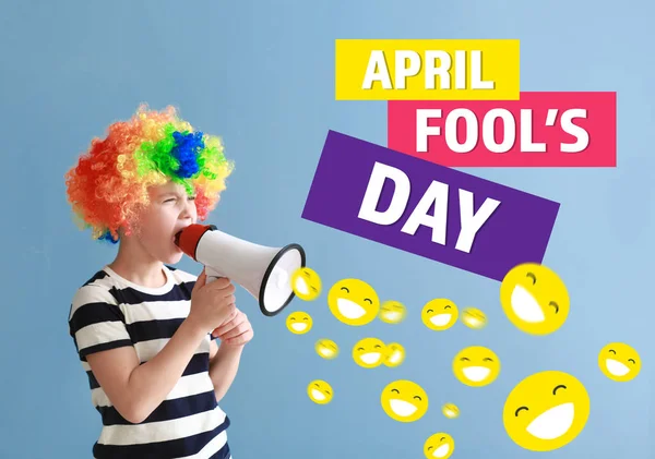 Kleine jongen in grappige vermomming en met megafoon op kleur achtergrond. April Fools ' dag viering — Stockfoto