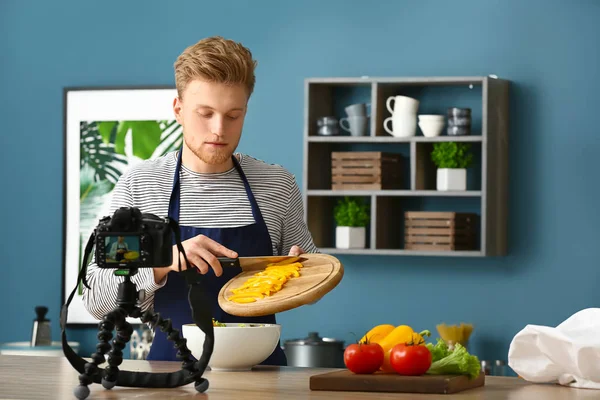 Young male food blogger recording video in kitchen — Stock Photo, Image