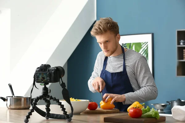 Young male food blogger recording video in kitchen — Stock Photo, Image