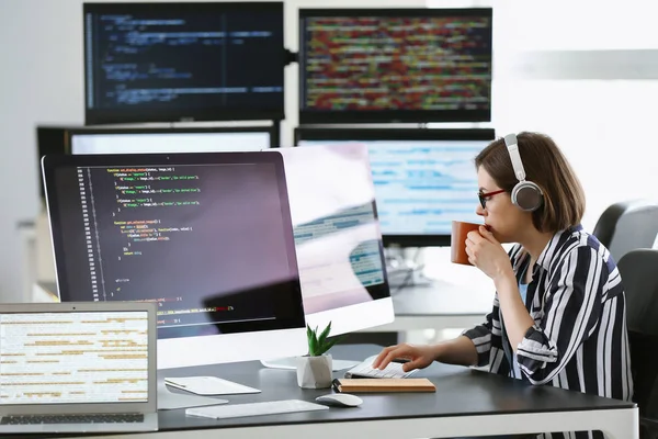 Female programmer working in office — Stock Photo, Image