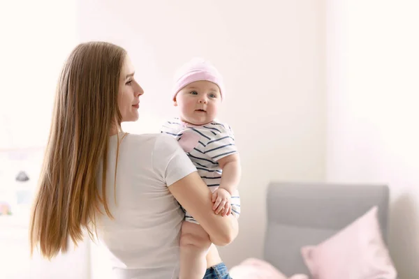 Happy mother with adorable baby girl at home — Stock Photo, Image