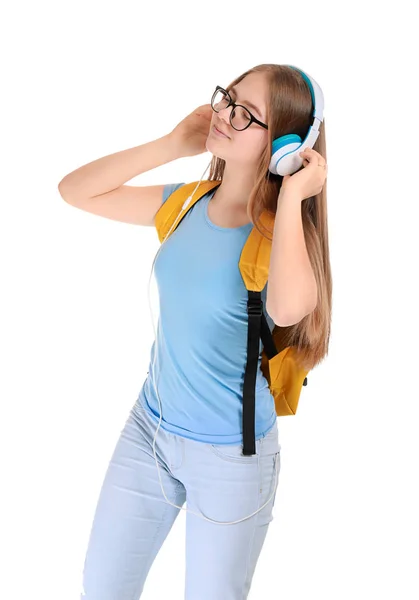 Cute teenage girl listening to music on white background — Stock Photo, Image