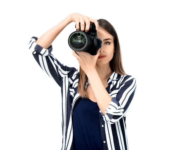 Young female photographer on white background — Stock Photo, Image