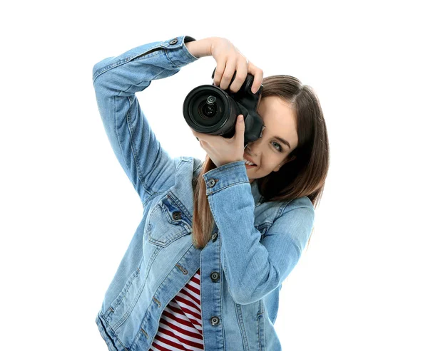 Young female photographer on white background — Stock Photo, Image