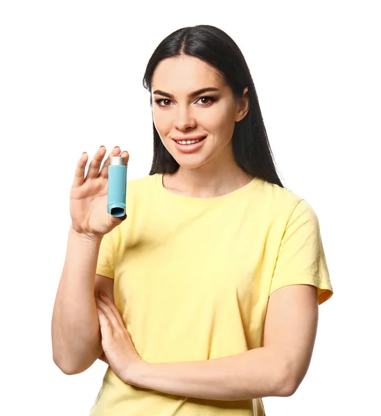 Young woman with inhaler on white background — Stock Photo, Image