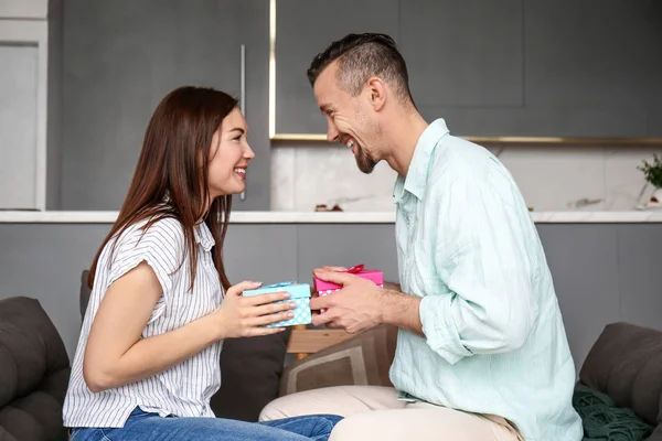 Happy couple greeting each others at home — Stock Photo, Image