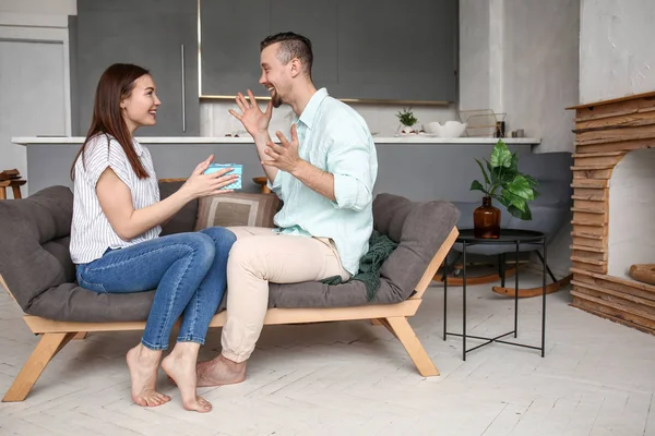 Happy woman greeting her boyfriend at home — Stock Photo, Image