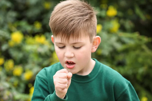 Boy having asthma attack outdoors on spring day — Stock Photo, Image