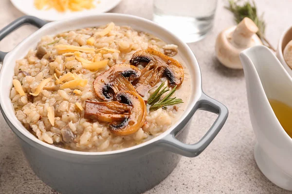 Pot with tasty risotto on table — Stock Photo, Image