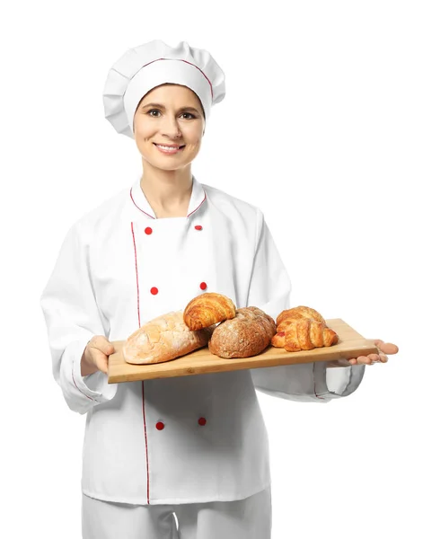 Femme chef avec des produits de boulangerie sur fond blanc — Photo