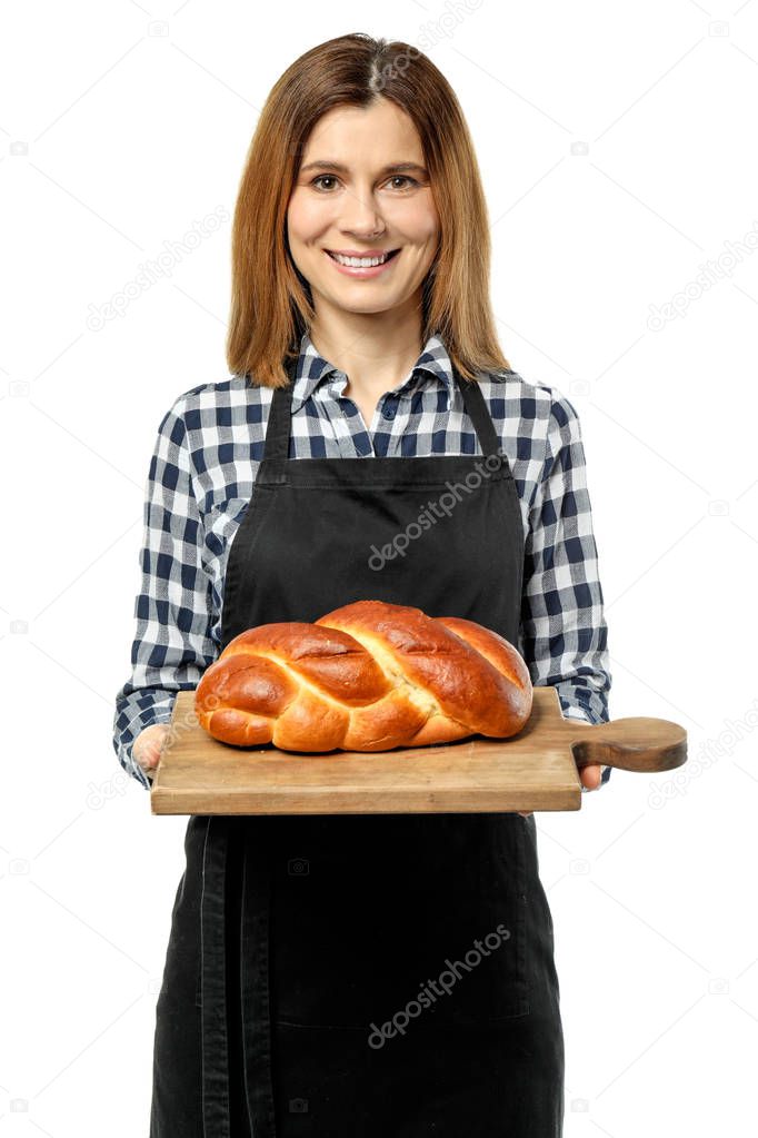 Female baker with pastry on white background