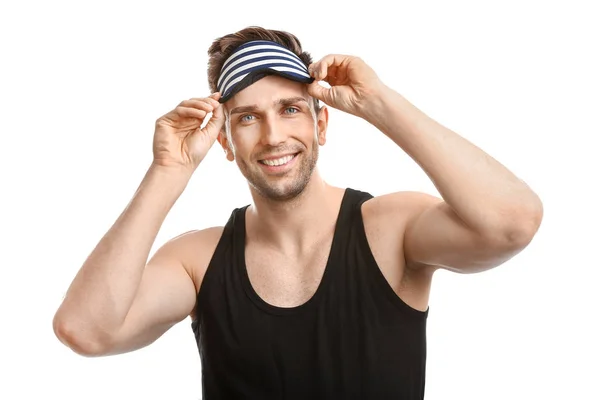 Young man with sleep mask on white background — Stock Photo, Image