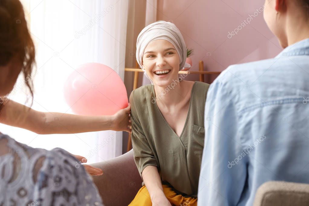 Women visiting her friend after chemotherapy at home