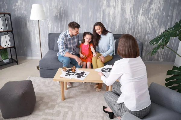 Family visiting psychologist in office