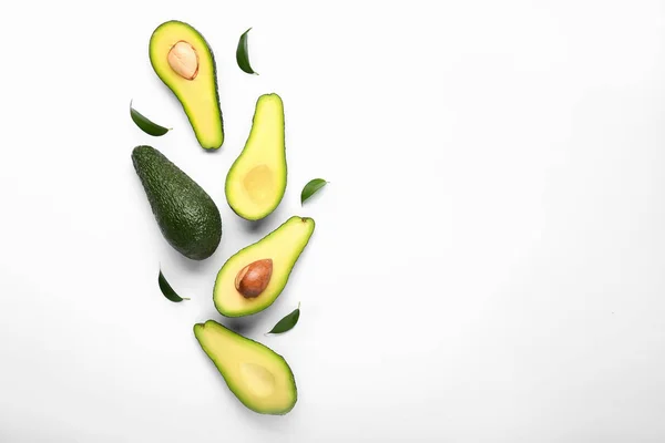 Cut fresh avocado on white background — Stock Photo, Image