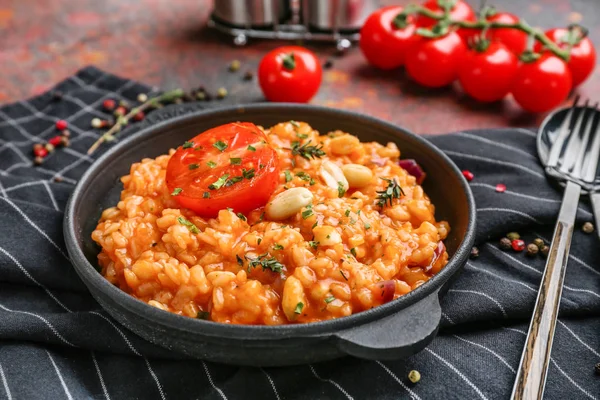 Frying pan with tasty risotto on table — Stock Photo, Image