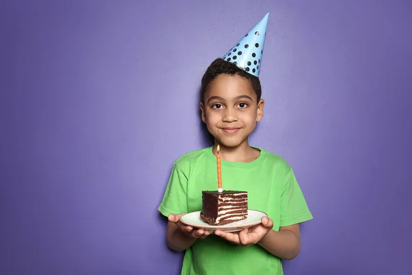Portrait of cute little boy with Birthday cake on color background — Stock Photo, Image