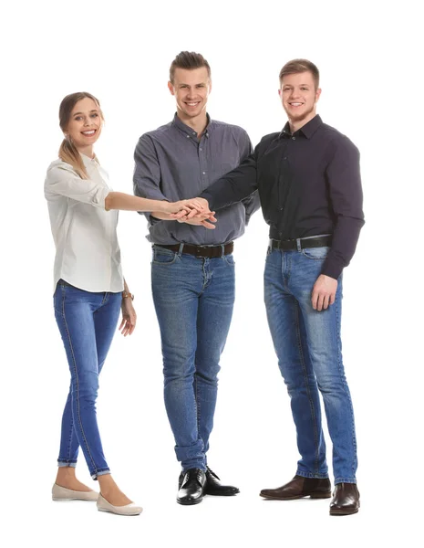 Group of young business people putting hands together on white background — Stock Photo, Image