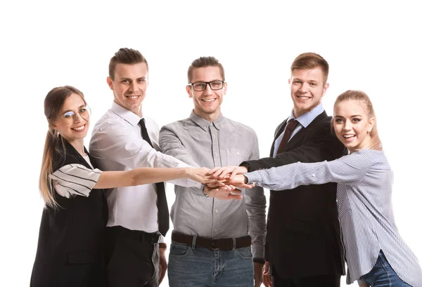 Group of young business people putting hands together on white background — Stock Photo, Image