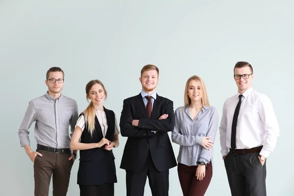 Group of young business people on light background — Stock Photo, Image