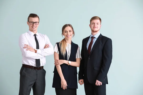 Group of young business people on light background — Stock Photo, Image