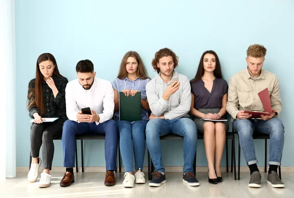 Young people waiting for job interview indoors — Stock Photo, Image
