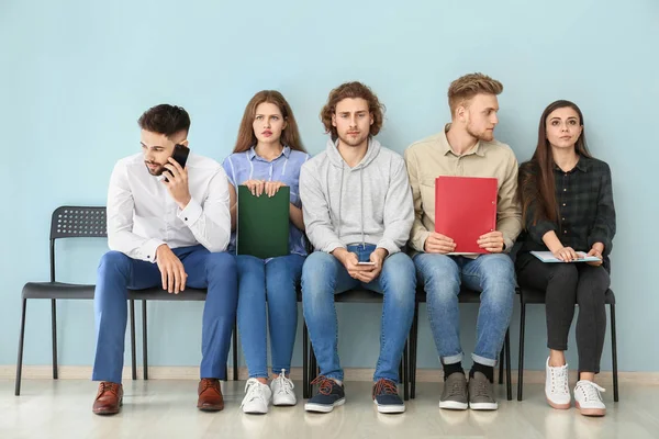 Young people waiting for job interview indoors — Stock Photo, Image