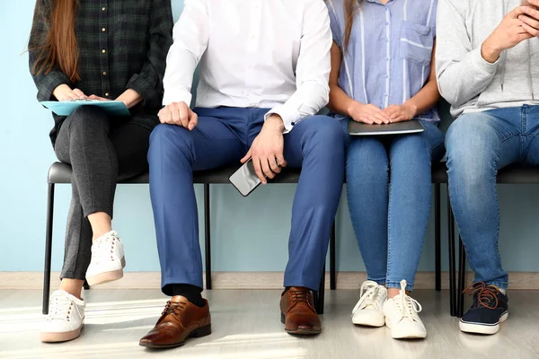 Young people waiting for job interview indoors — Stock Photo, Image