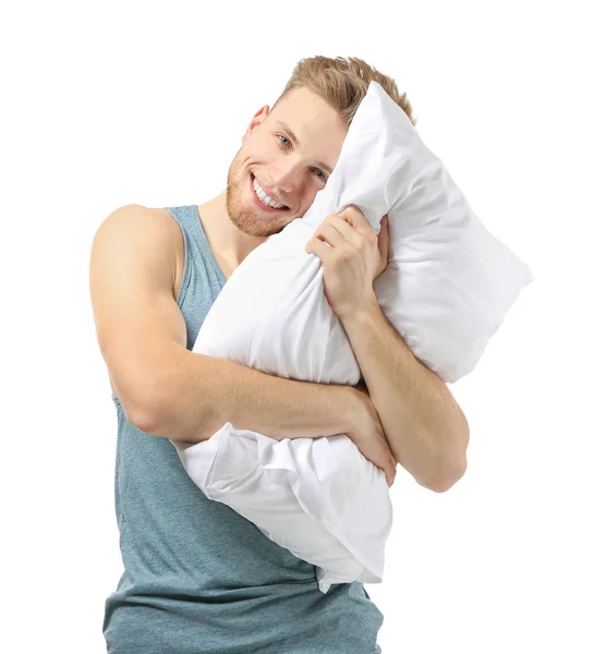 Hombre guapo con almohada sobre fondo blanco —  Fotos de Stock