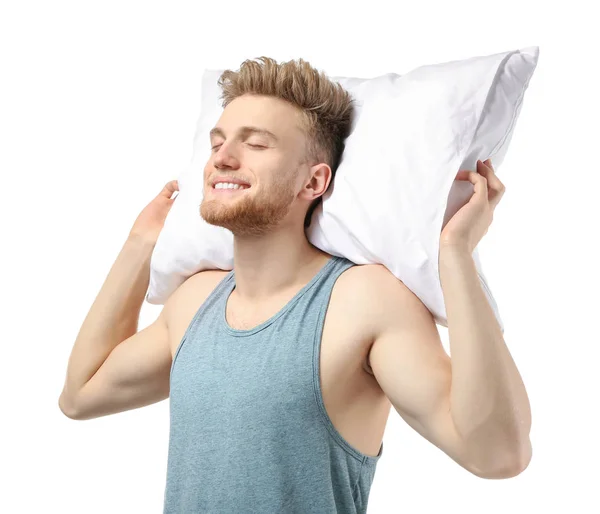 Hombre guapo con almohada sobre fondo blanco —  Fotos de Stock