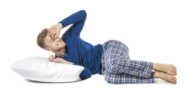 Hombre adormilado guapo con almohada sobre fondo blanco —  Fotos de Stock