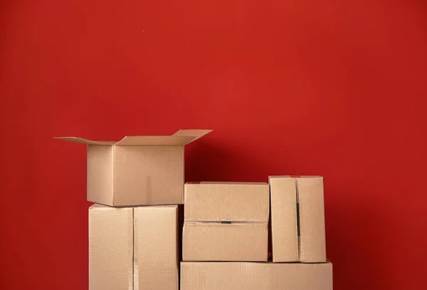 Cardboard boxes on color background