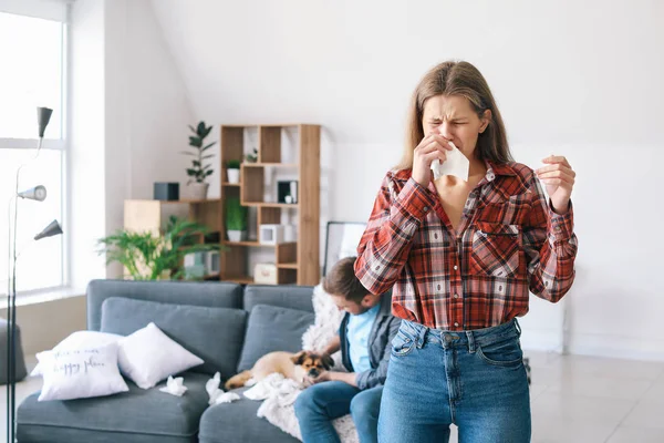 Woman suffering from pet allergy at home — Stock Photo, Image