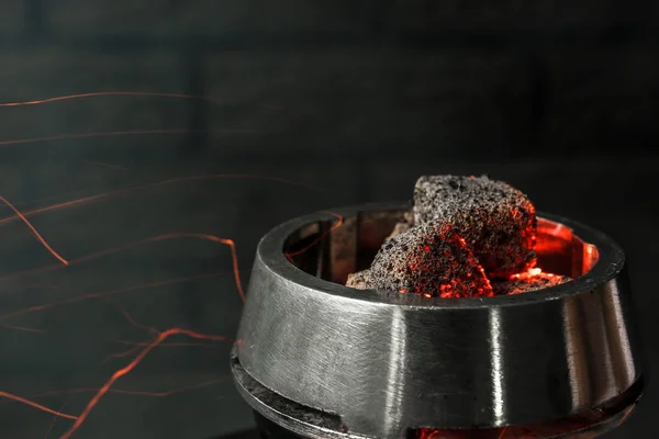Burning coal for hookah on dark background — Stock Photo, Image