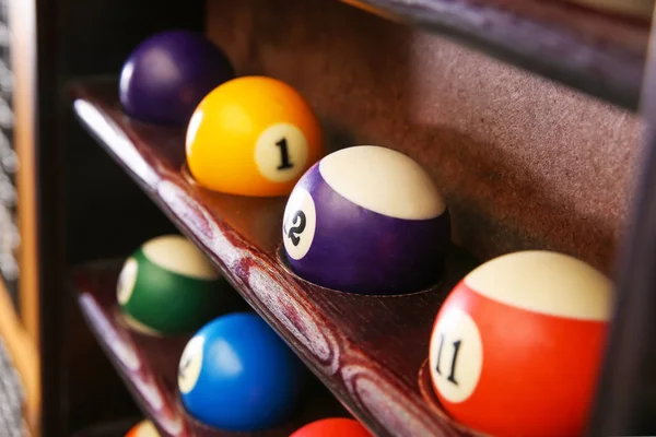 Wooden shelves with billiard balls — Stock Photo, Image