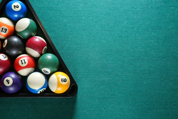 Billiard balls in triangle rack on table — Stock Photo, Image