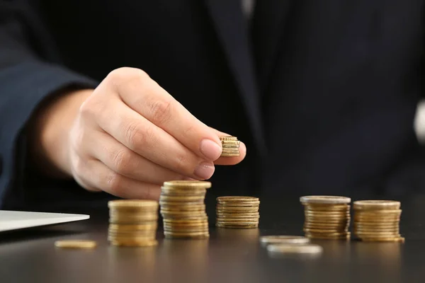 Woman counting savings at table — Stock Photo, Image