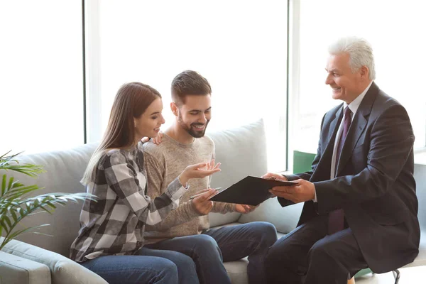 Couple meeting with notary public in office