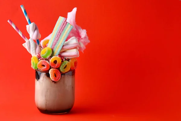 Delicious freak shake on color background — Stock Photo, Image