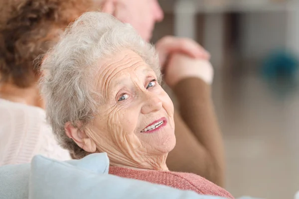 Happy senior woman in nursing home