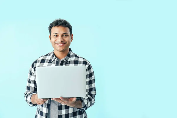 Happy man with laptop on color background — Stock Photo, Image