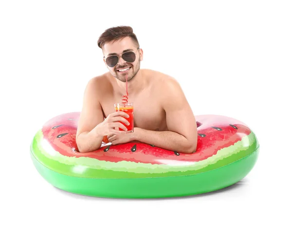 Happy young man with inflatable ring and cocktail on white background — Stock Photo, Image