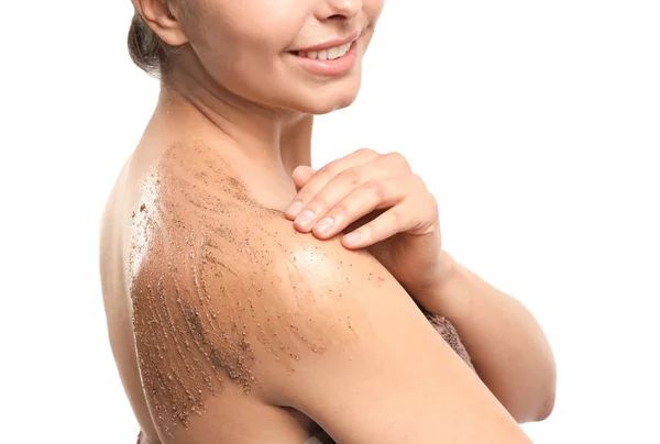 Beautiful young woman applying body scrub against white background, closeup — Stock Photo, Image