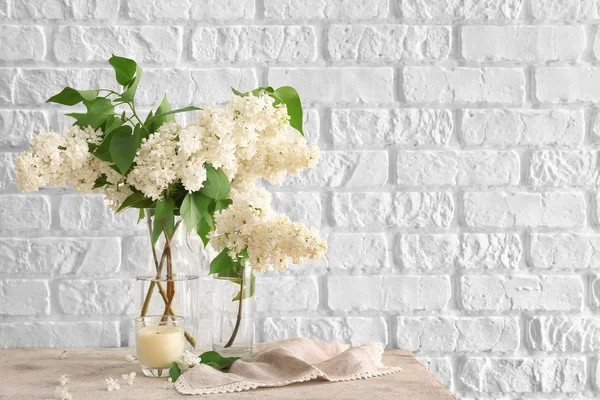 Beautiful lilac flowers on table — Stock Photo, Image