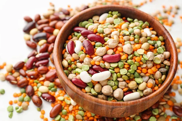 Bowl with different legumes on  table — Stock Photo, Image